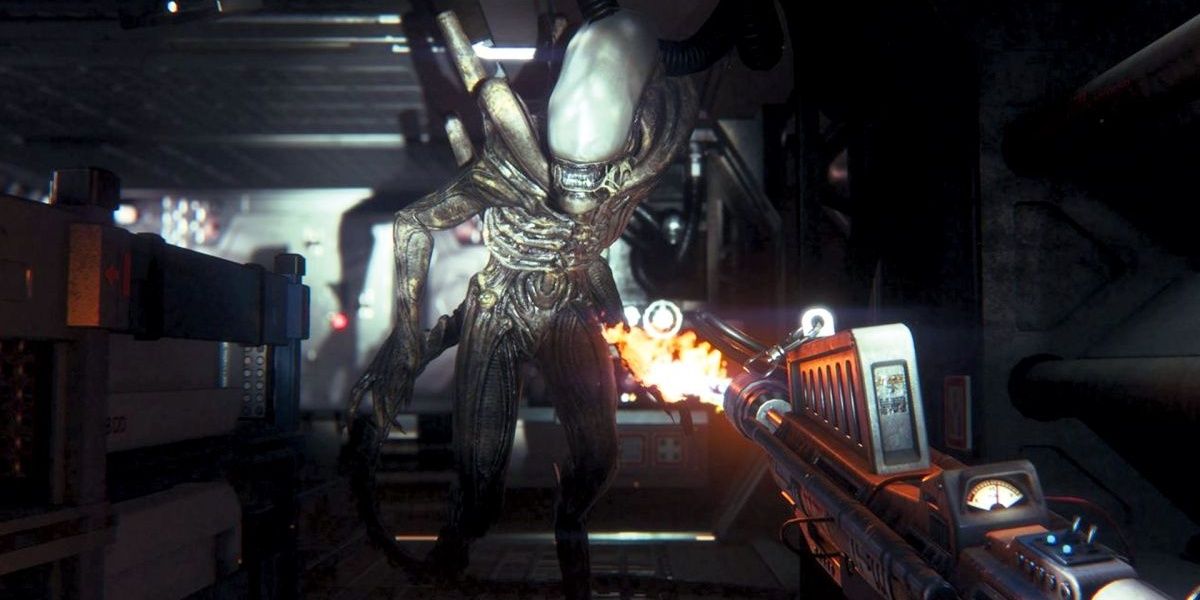 Alien Isolation Amanda Ripley firing a flamethrower at an Alien Xenomorph