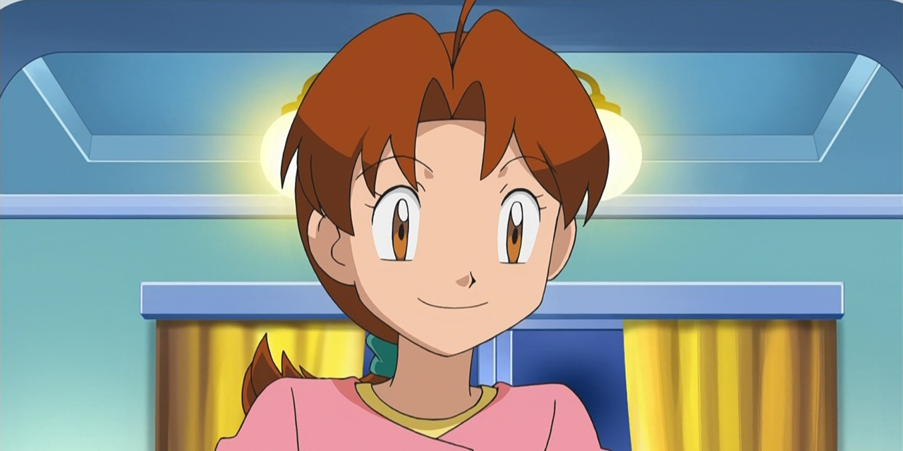 Delia Ketchum from Pokemon standing in a blue room smiling