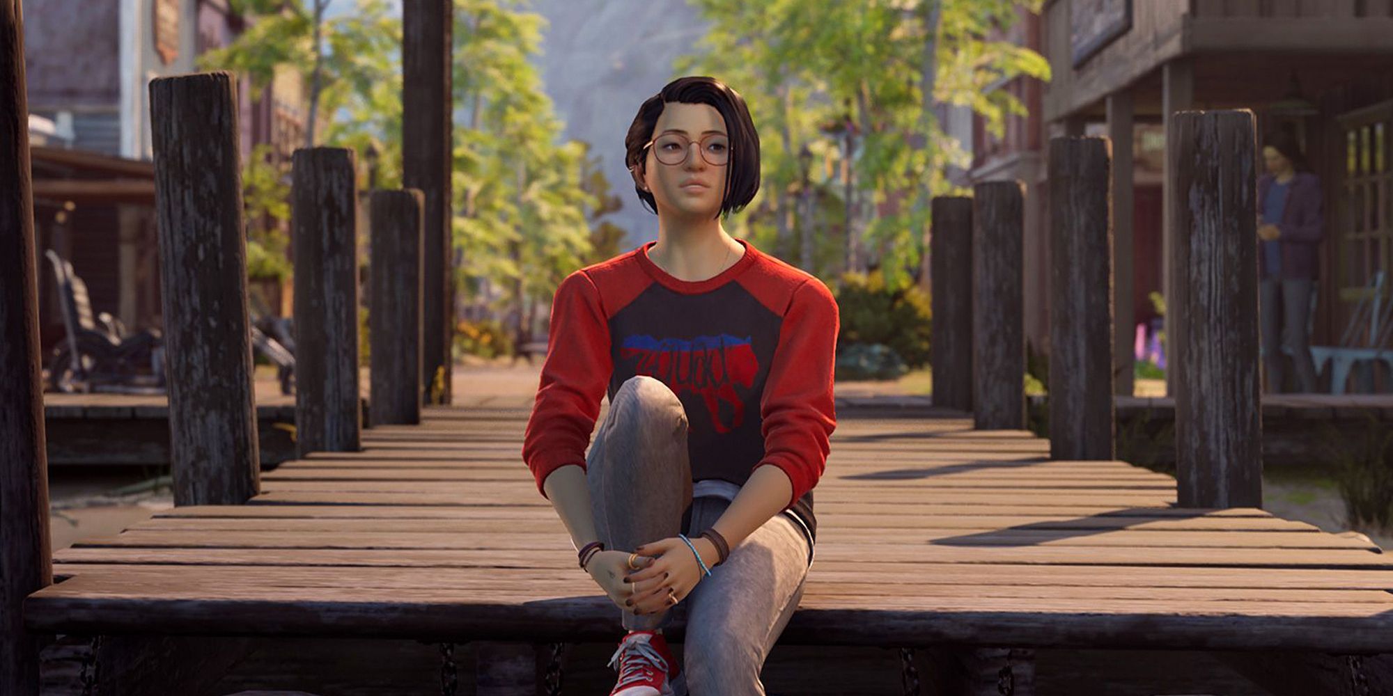 Alex Chen from Life Is Strange: True Colors, sitting on the edge of a pier. She looks conflicted.
