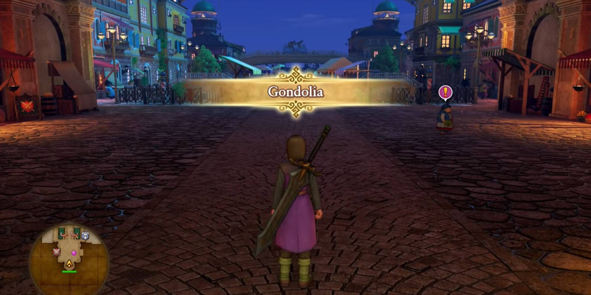 Dragon Quest Hero stood before colourful buildings that lie in the distance with the word Gondolia in gold above their head