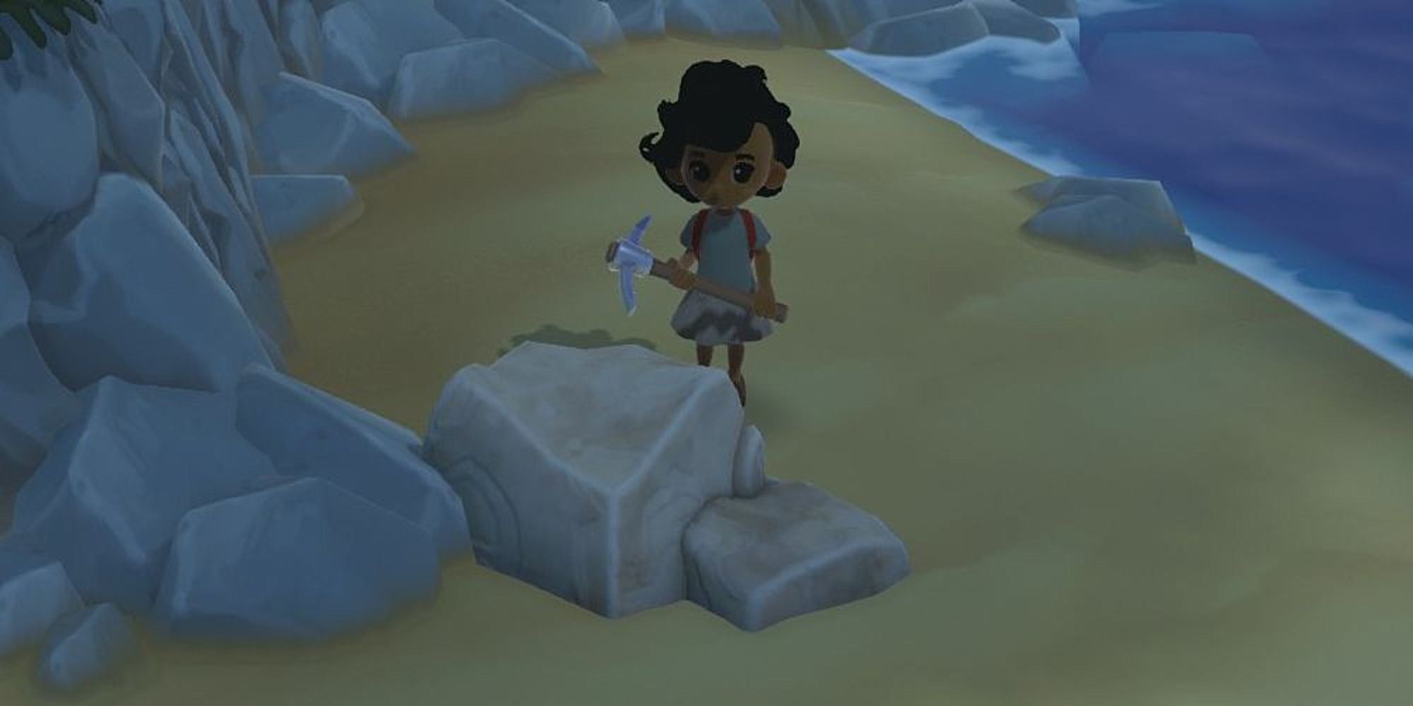 Hokko Life holding pickaxe near beach rock