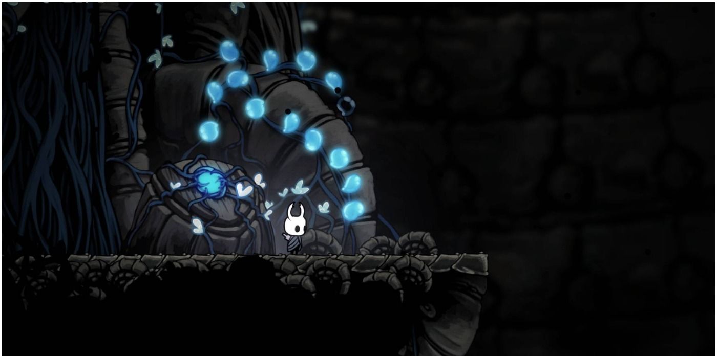 Hollow Knight - The Knight Standing Next to the Lifeblood Door in the Ancient Basin 
