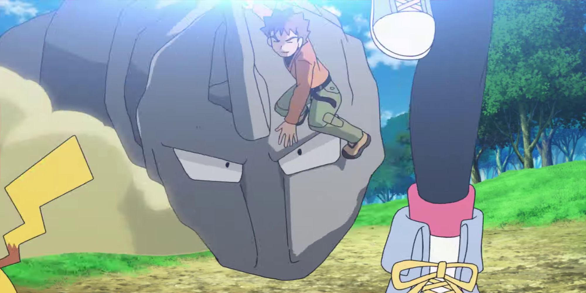 Trainer Brock riding Onix behind others in a forest