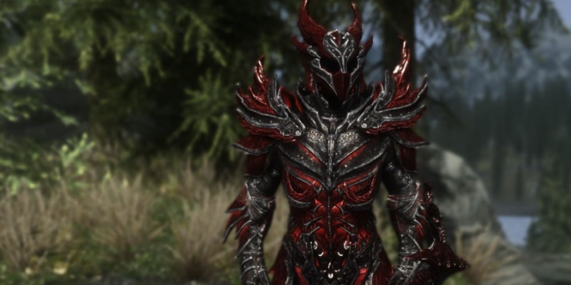skyrim_character_wearing_daedric_armor_in_front_of_tree