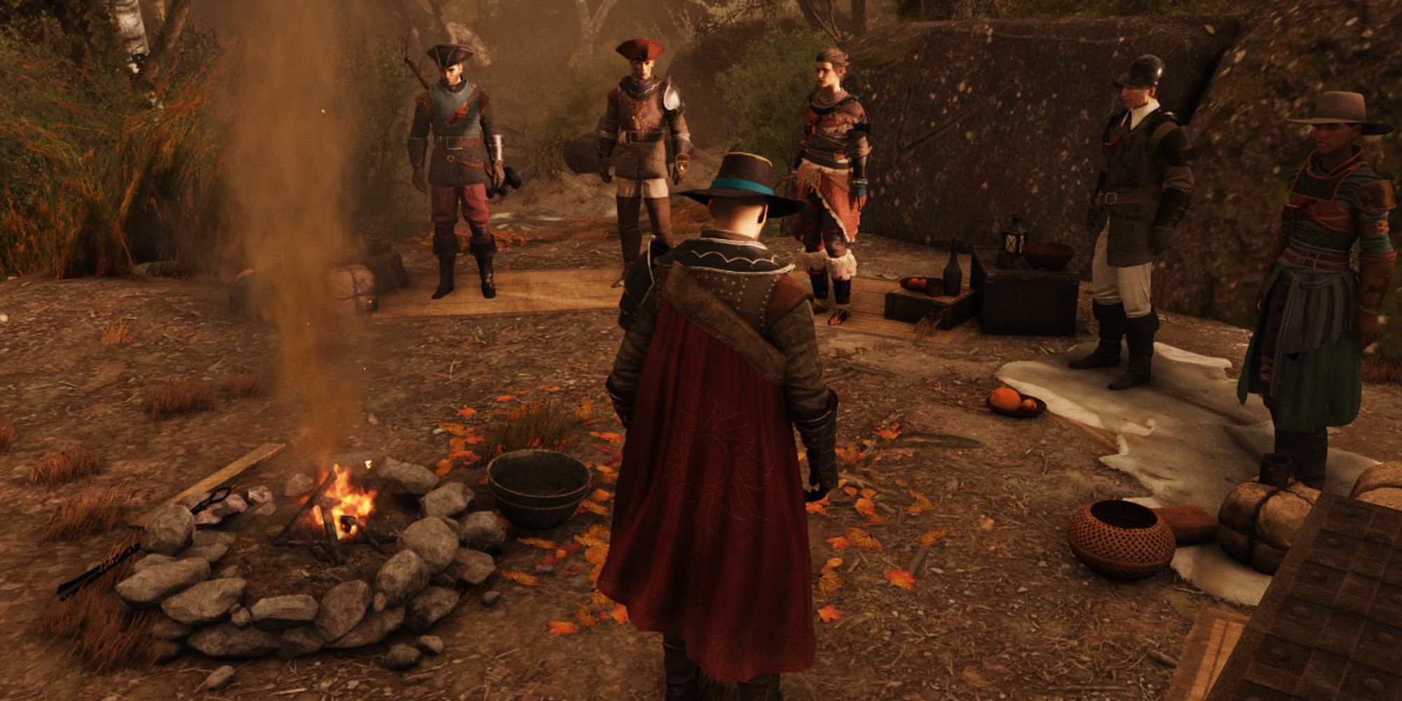 Fast Travel In Video Games a mid shot of De Sardet from Greedfall stood next to a campfire with his various companions stood around it too facing him with autumnal leaves, pots and pans scattered across the floor and dying trees off into the distance