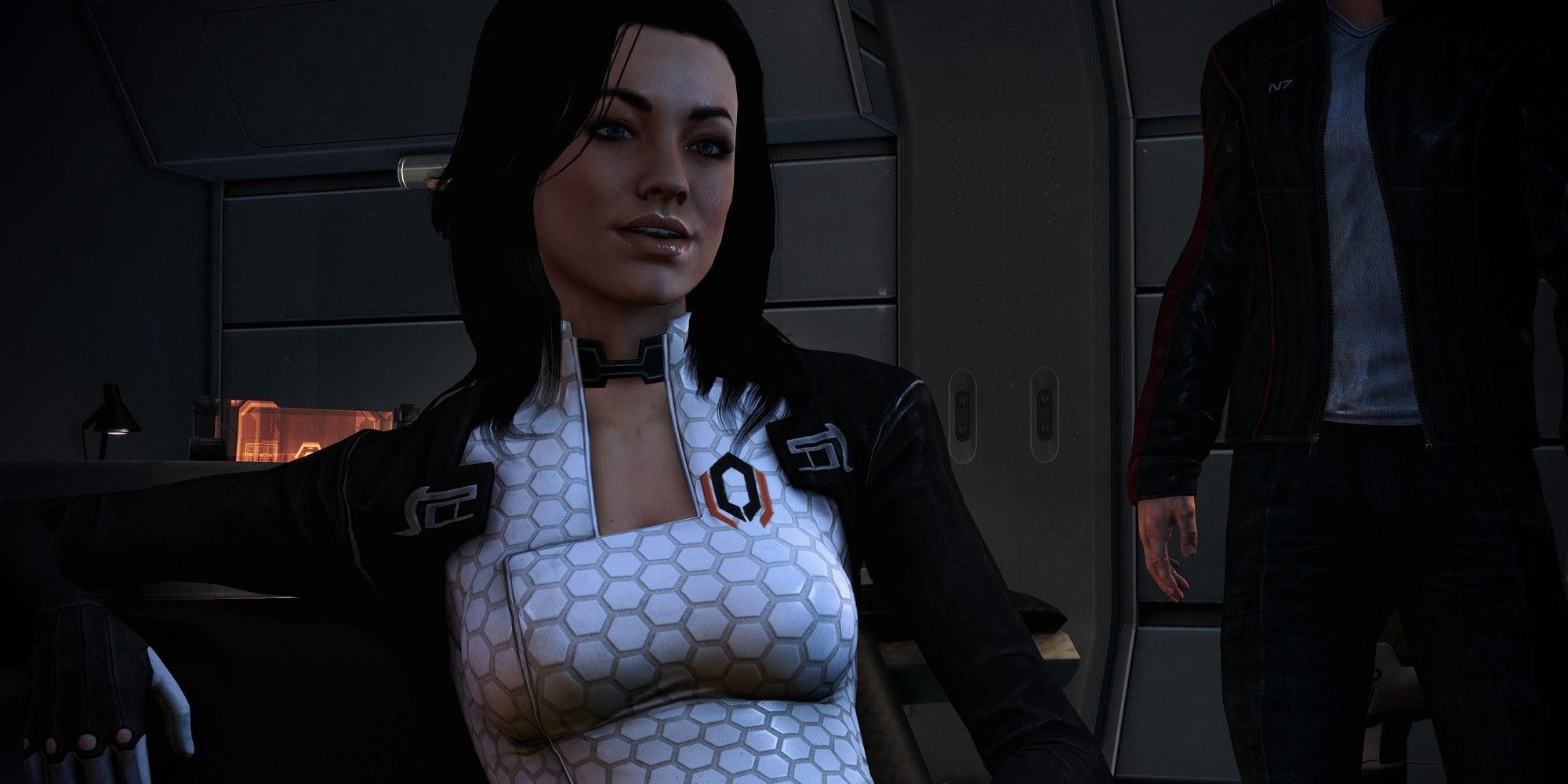 Miranda Lawson Seated With Shepard In The Background in Mass Effect 2