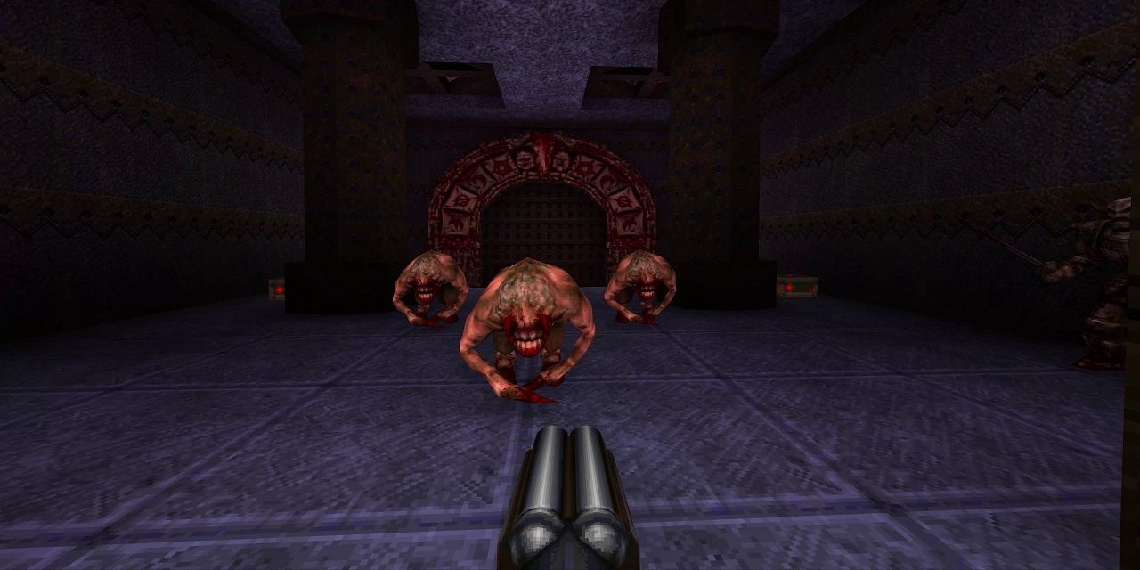 Quake Guy facing down three demons with a double-barrelled shotgun