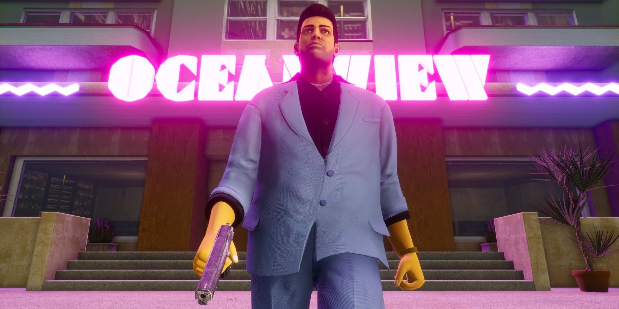 A screenshot showing Tommy Verceti in front of the Oceanview Hotel in Grand Theft Auto: Vice City - The Definitive Edition