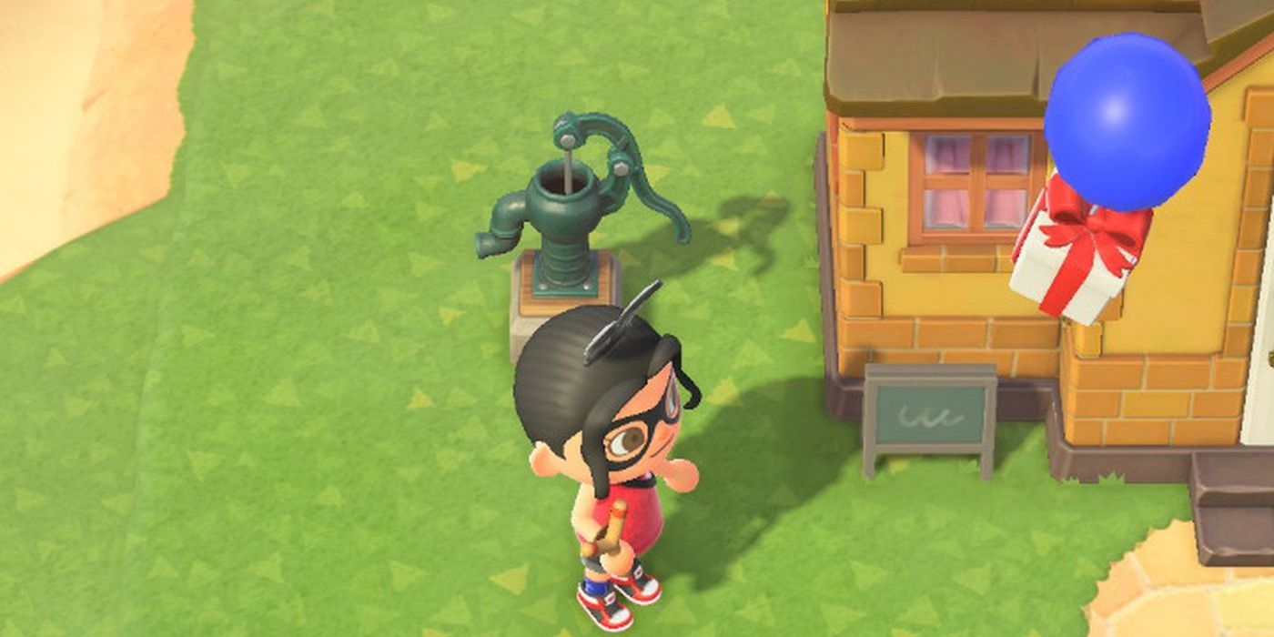 Animal Crossing New Horizons Player Watching A Blue Balloon Gift Floating Right Next To House