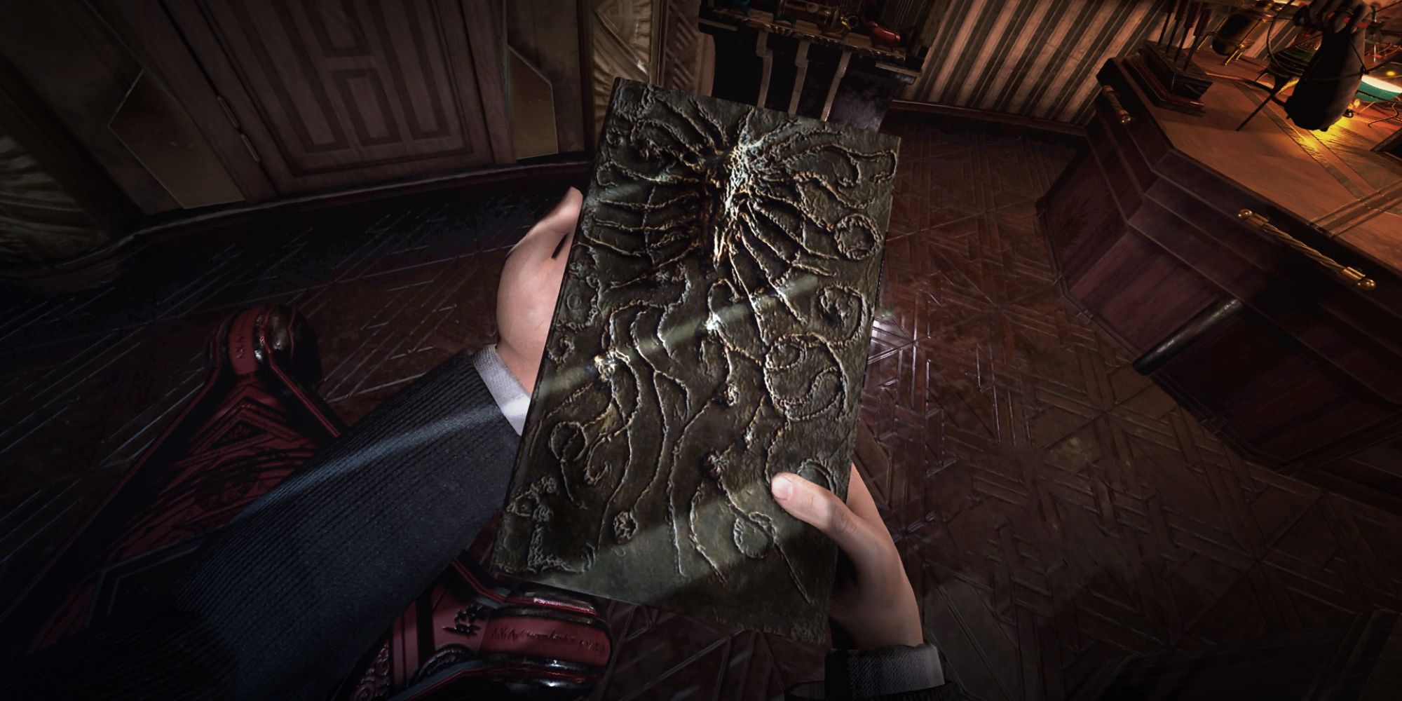 Best Puzzle VR Games a POV shot of a person holding a mysterious book with an eldritch-esque monster on the front from Nevrosa: Escape