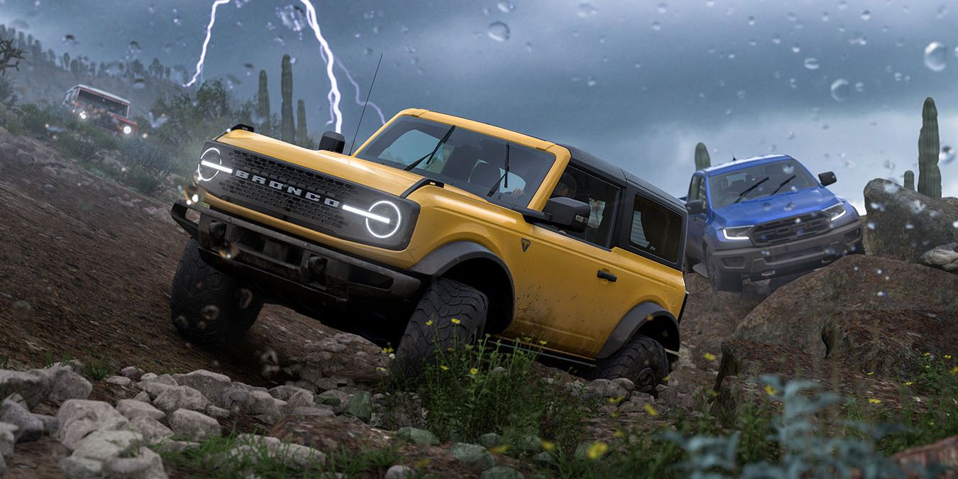 Three cars going off-road during a thunderstorm in Forza Horizon 5