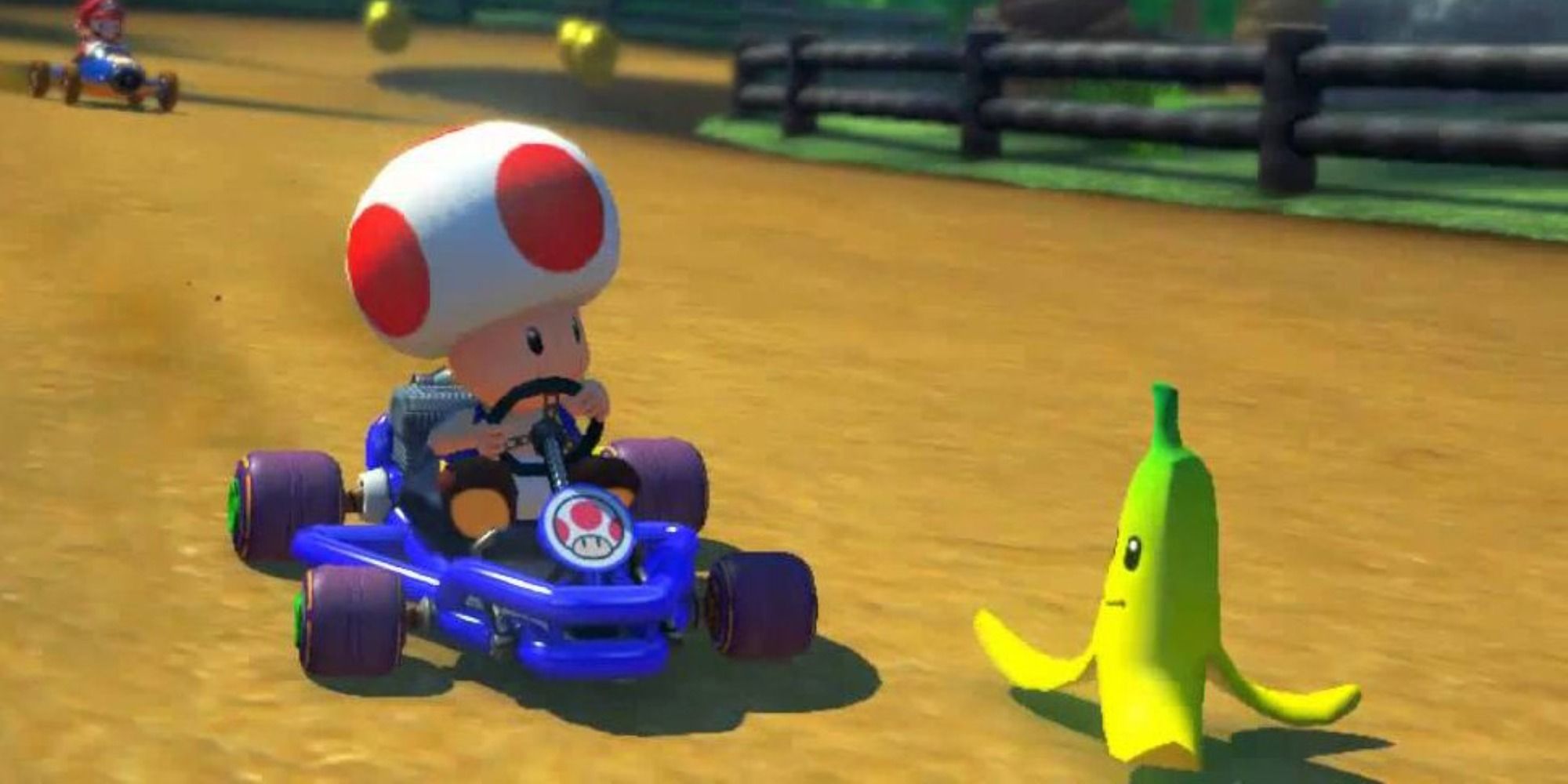 Toad driving towards a thrown Banana Peel in Mario Kart 8 Deluxe