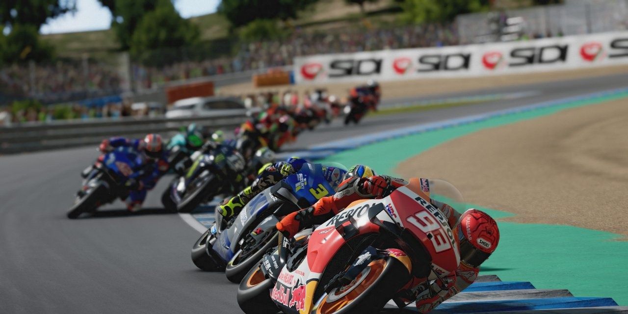 MotoGP 2021 line of bikes leaning around a bend