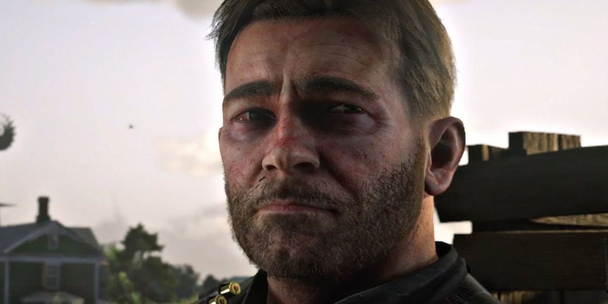 Red Dead Redemption 2 screenshot of Arthur Morgan looking sad.