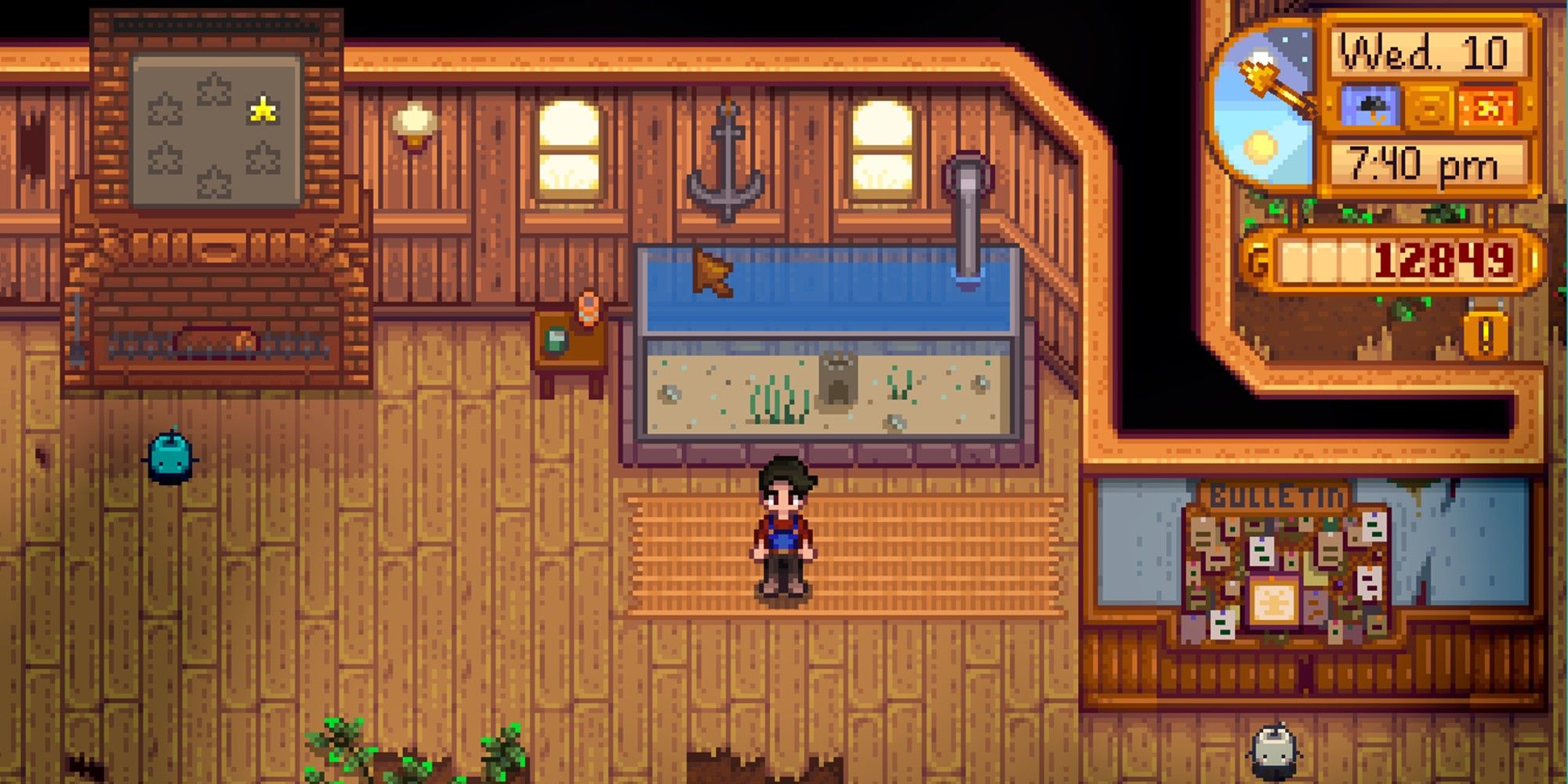 player standing next to fish tank in community center
