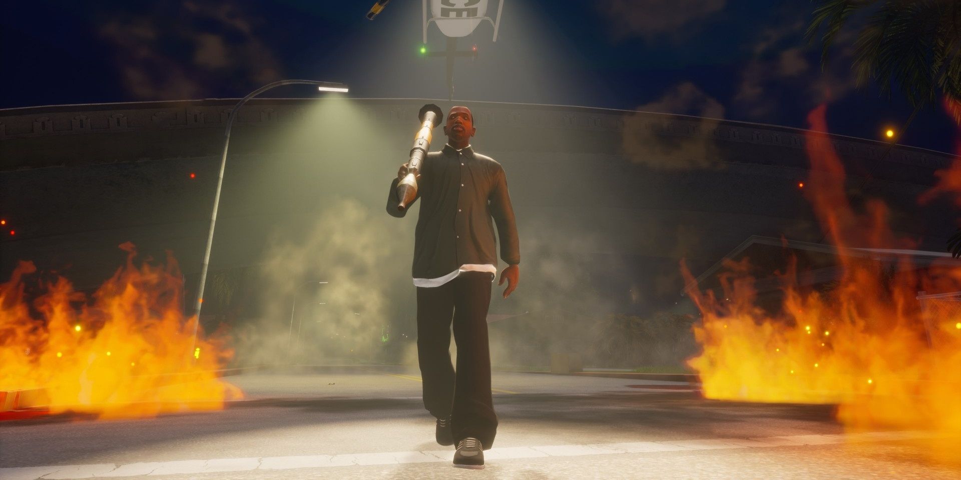 A screenshot showing CJ with a rocket launcher walking in front of flames in Grand Theft Auto: San Andreas - The Definitive Edition