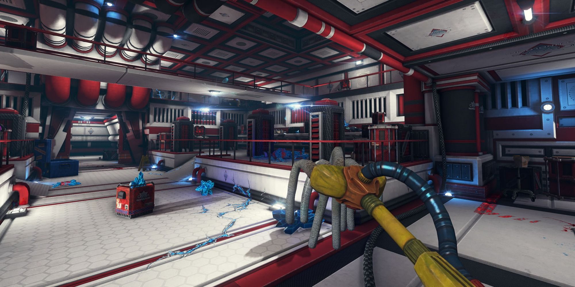 Player holds mop in a sterile facility with white floors and red pipes everywhere