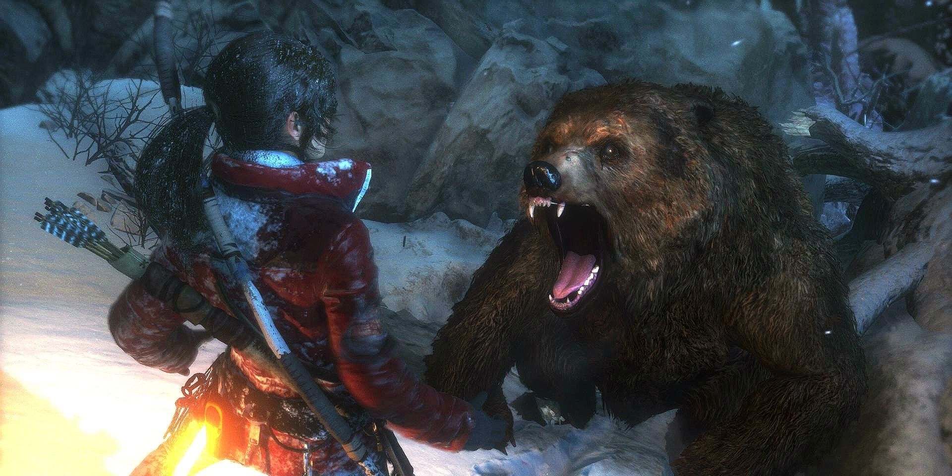 A screenshot showing Lara Croft being attacked by a bear in Rise of the Tomb Raider