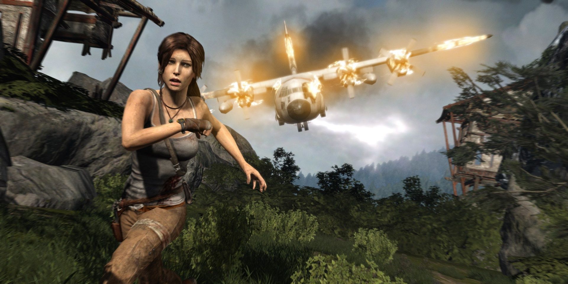 A screenshot showing Lara Croft running from a crashing plane in Tomb Raider (2013)