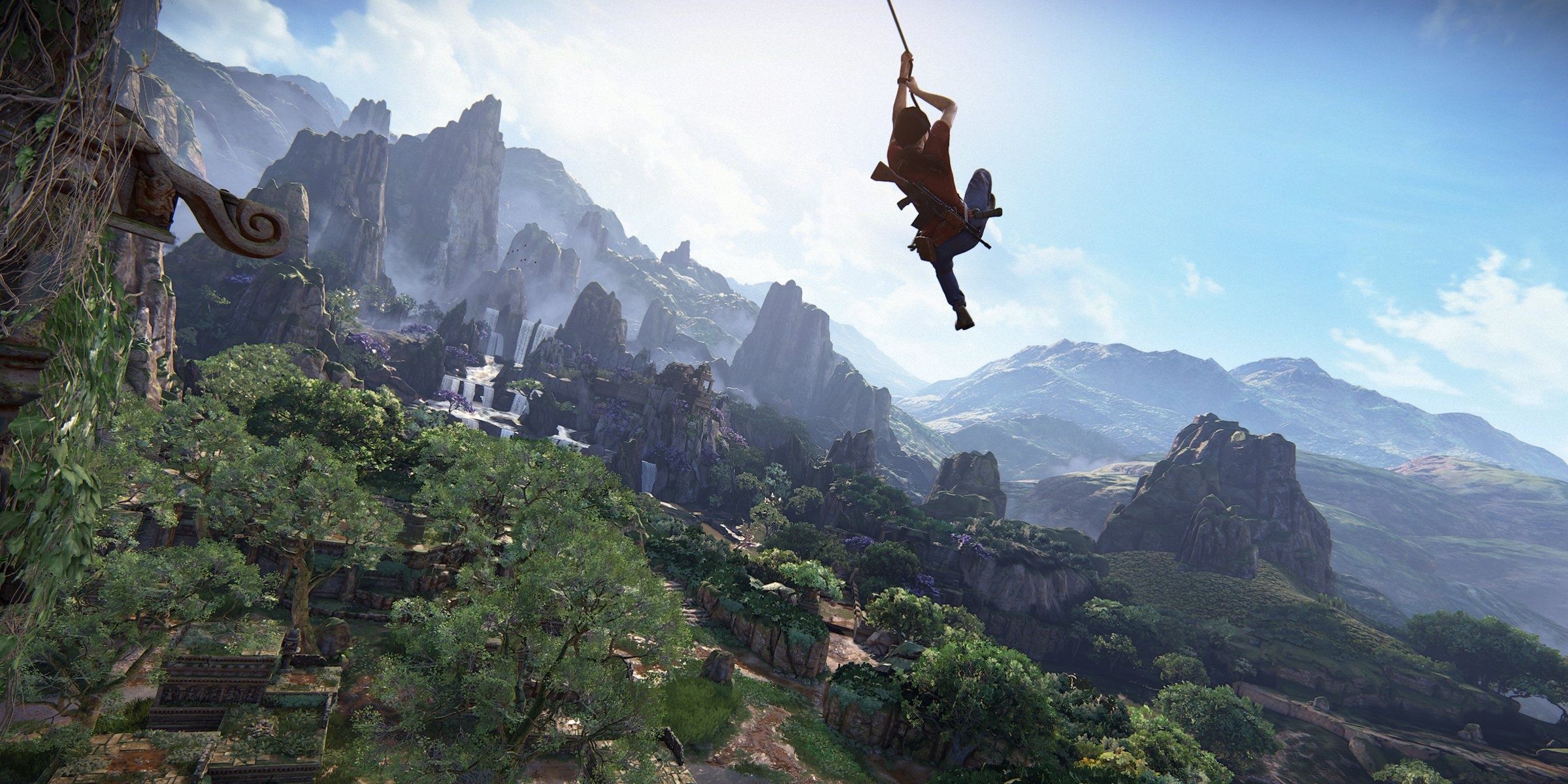 A screenshot showing Chloe swinging from a vine in Uncharted: The Lost Legacy