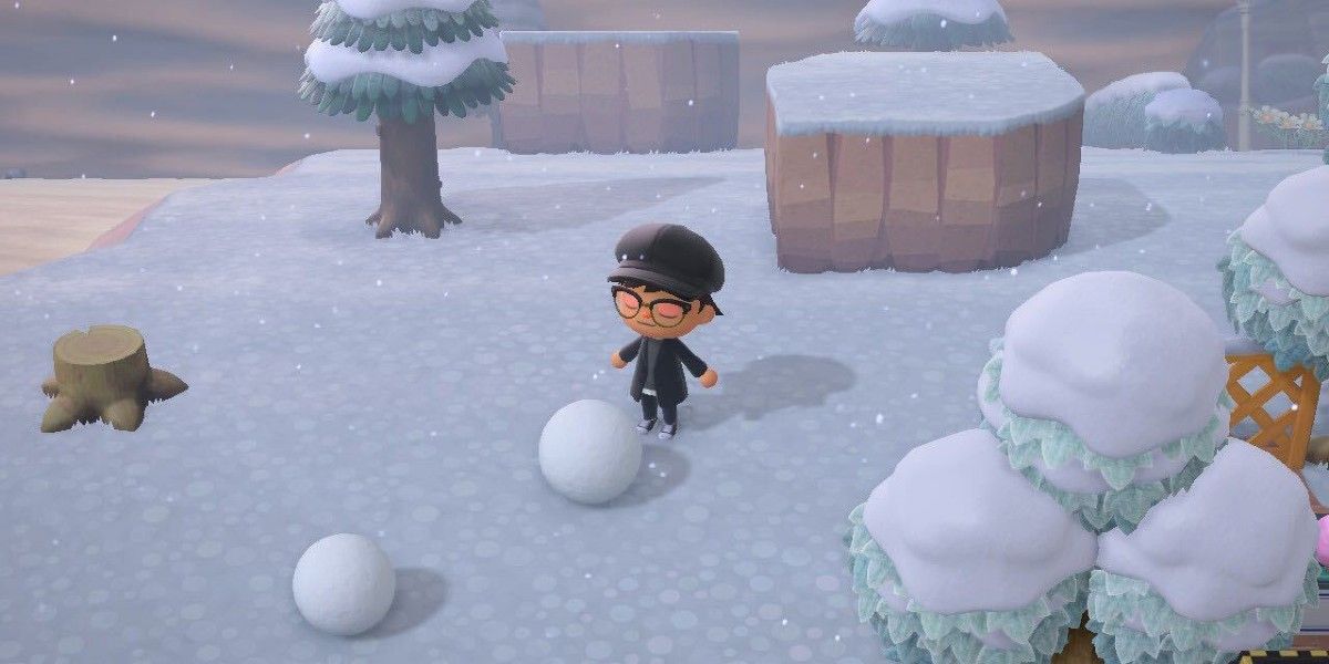 animal crossing new horizons villager with two snowballs in winter snow
