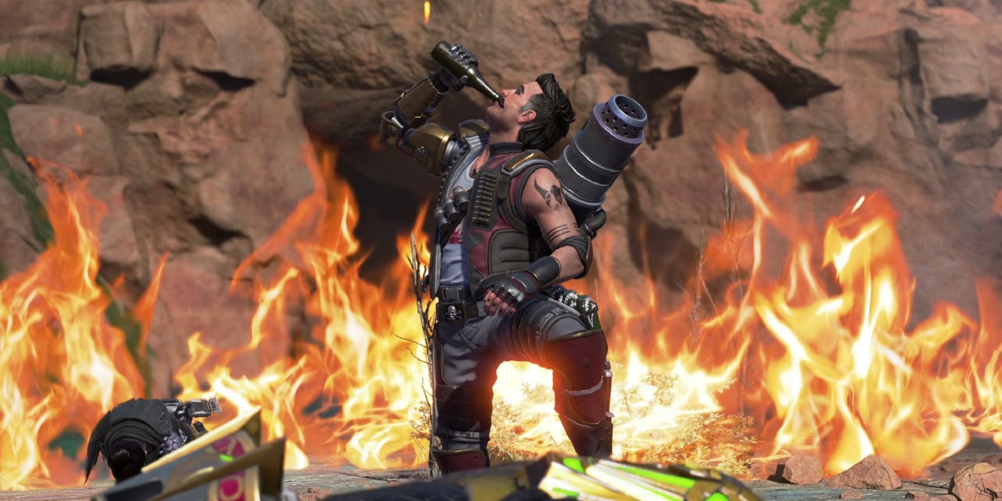 Fuse drinking a beer in front of a flaming wall in Apex Legends