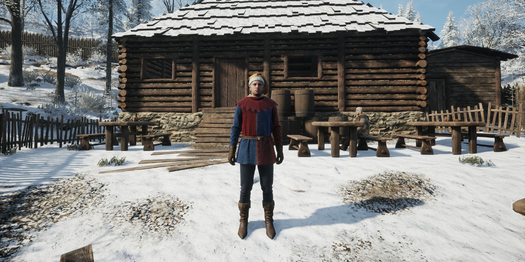 herald in jester outfit standing outside in the snow