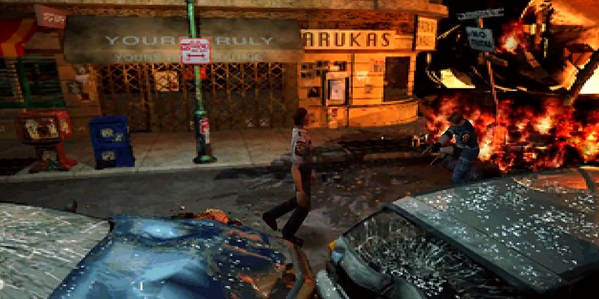 Leon shooting a zombie in the streets of Raccoon City in Resident Evil 2 near a burning wreck.