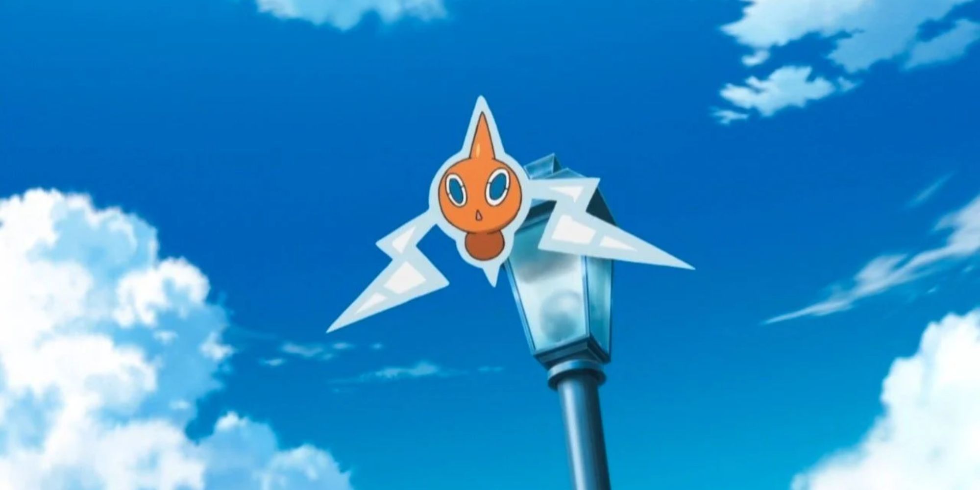 Rotom flying by top of a lamppost 