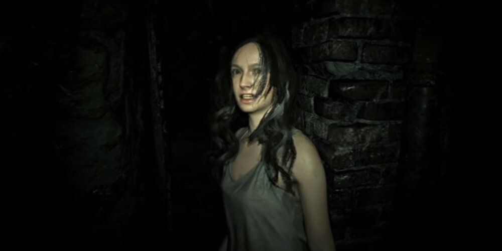 A Screenshot From VR Gameplay Of Mia From Resident Evil 7 When She Is First Found In The Baker's House.