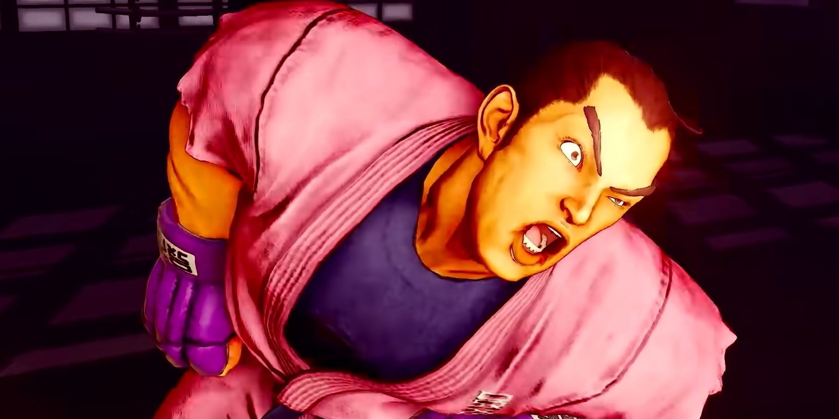 Street Fighter 5's Dan being a goofball and mugging for the camera