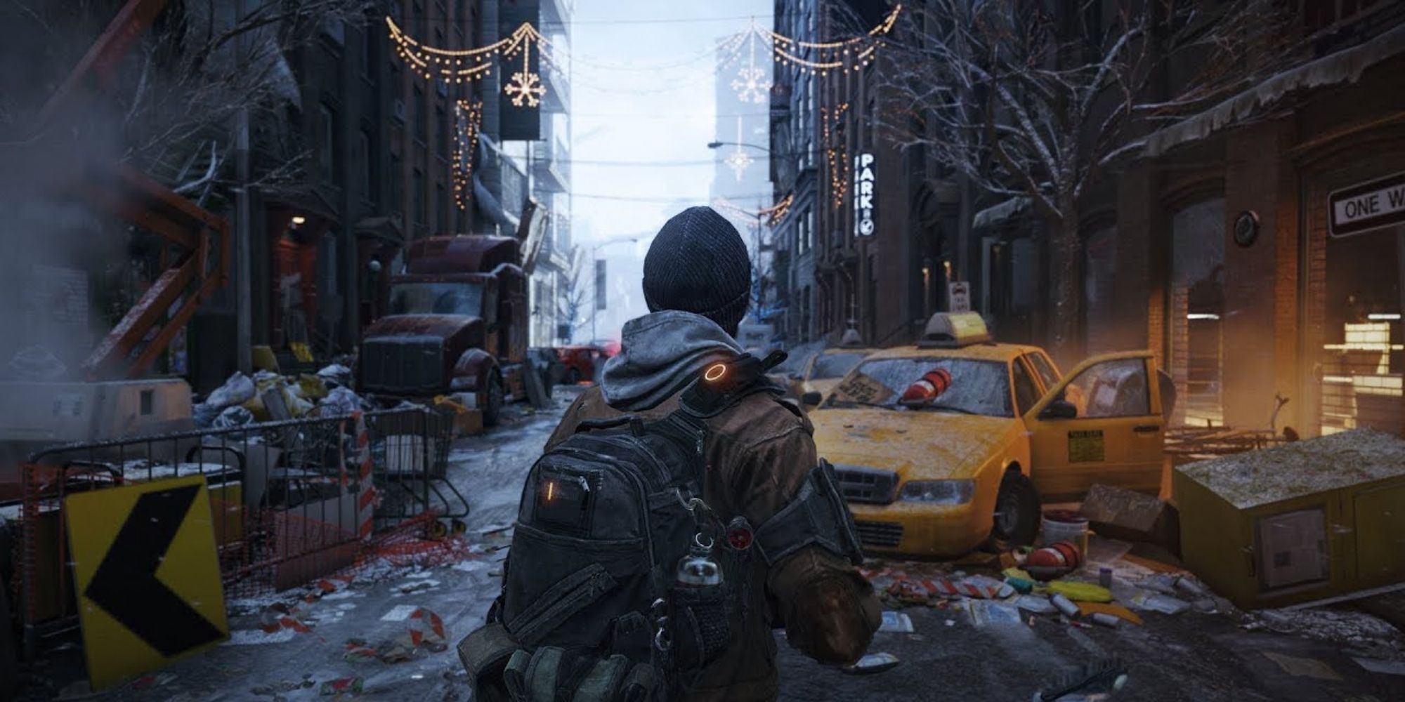 A Operative From The Division Stands In Front Of Some Christmas Lights