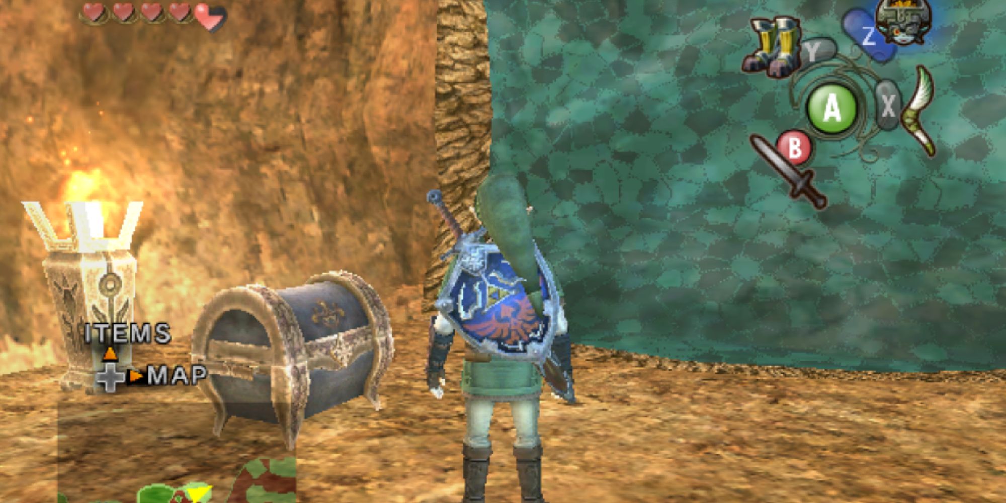 A screenshot of the Goron Mines dungeon in The Legend of Zelda: Twilight Princess, showing Link gazing at a treasure chest next to an iridescent blue magnet wall