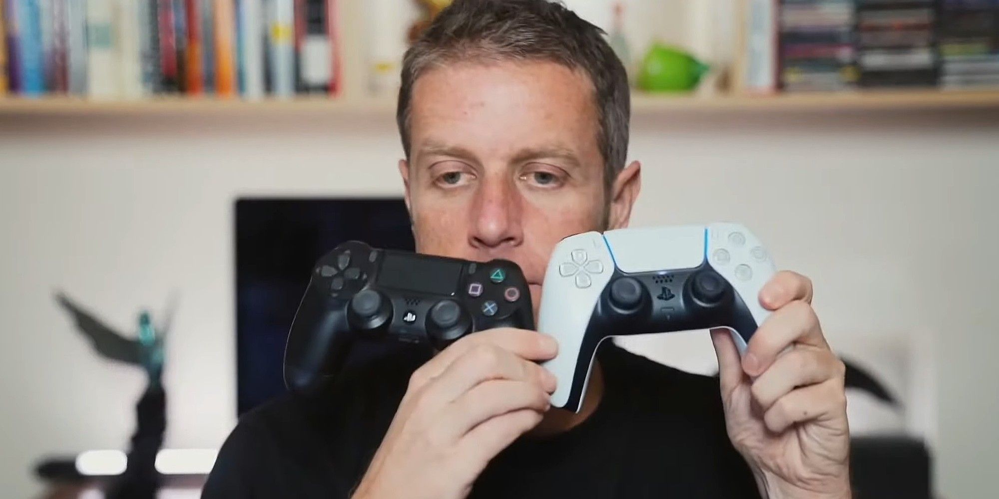 Geoff Keighley Holding PS4 And PS5 Controllers In His Hands