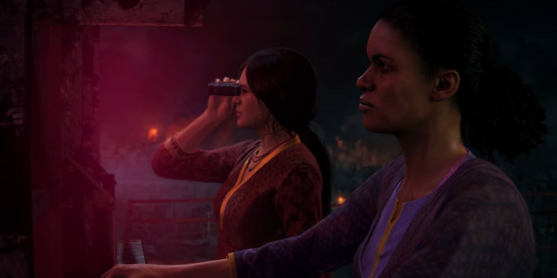 Chloe and Nadine by a neon sign in Uncharted: The Lost Legacy