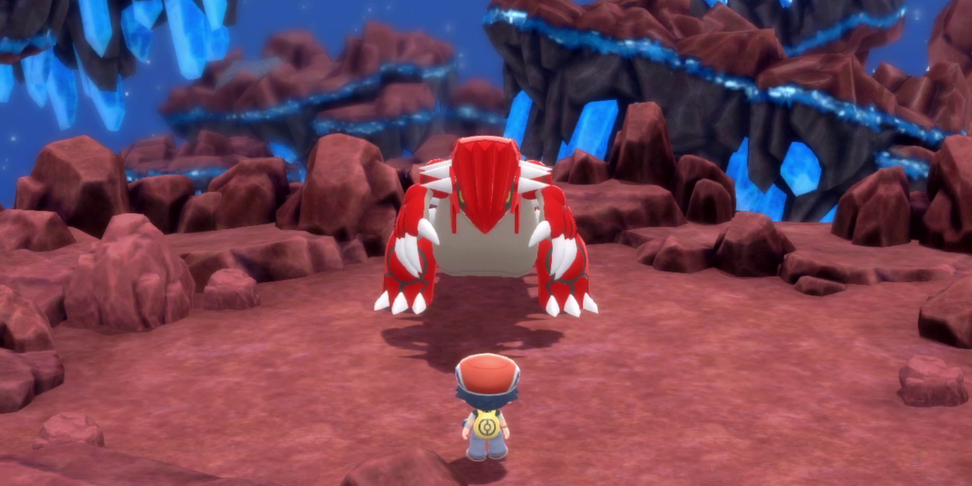 Player walking up to Groudon, the legendary red-dragon of the ground