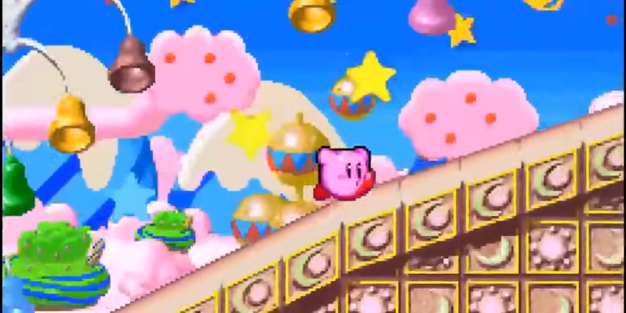 Kirby sprints through a pastel-colored course in the Gourmet Race mode in Kirby Super Star