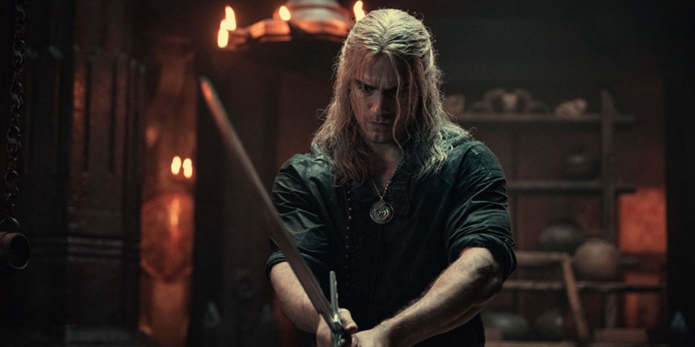 Henry Cavill as Geralt wielding a sword