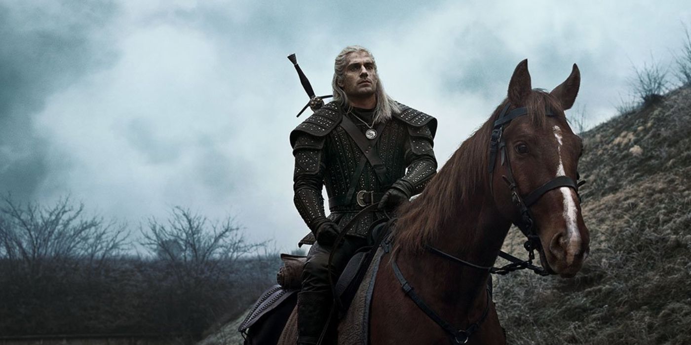 Henry Cavill riding a horse in the witcher