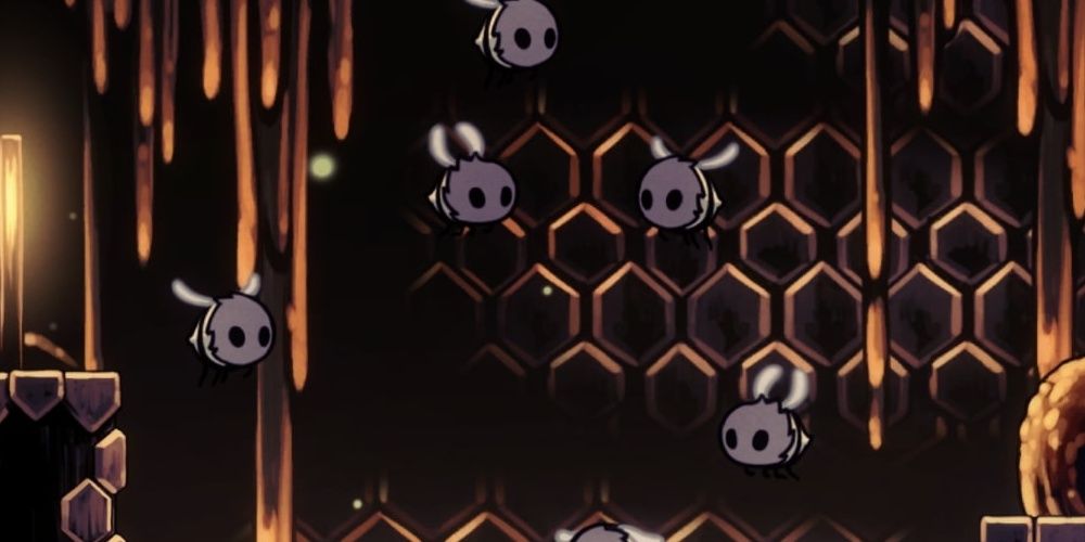 A group of Hivelings in Hollow Knight pictured in the Hive.