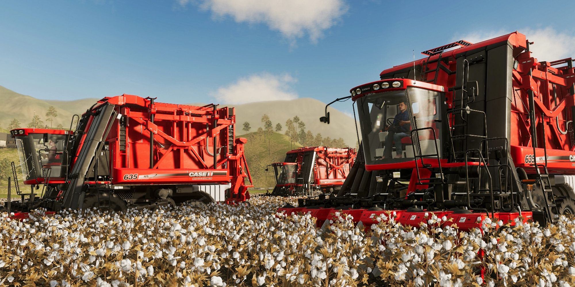 Farming Simulator 19 red cars in the grass. Blue sky behind.