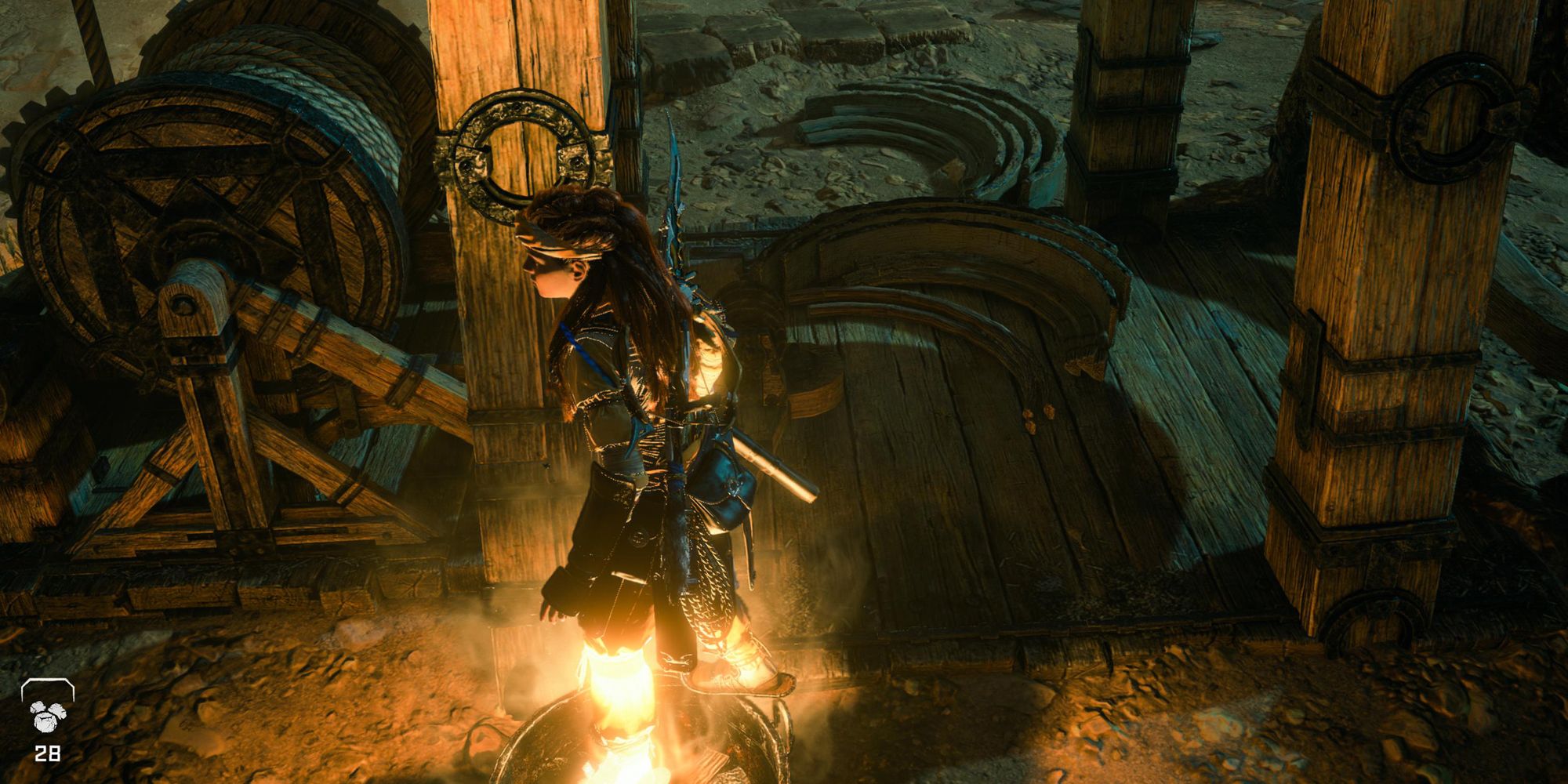 Horizon Forbidden West Aloy standing in a brazier.