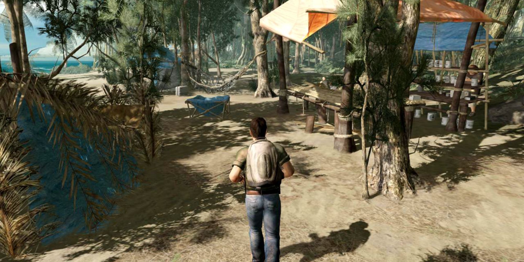 A wide angle, third-person perspective screenshot from the game Lost: Via Domus featuring the protagonist Elliot running across a beach with a backpack on