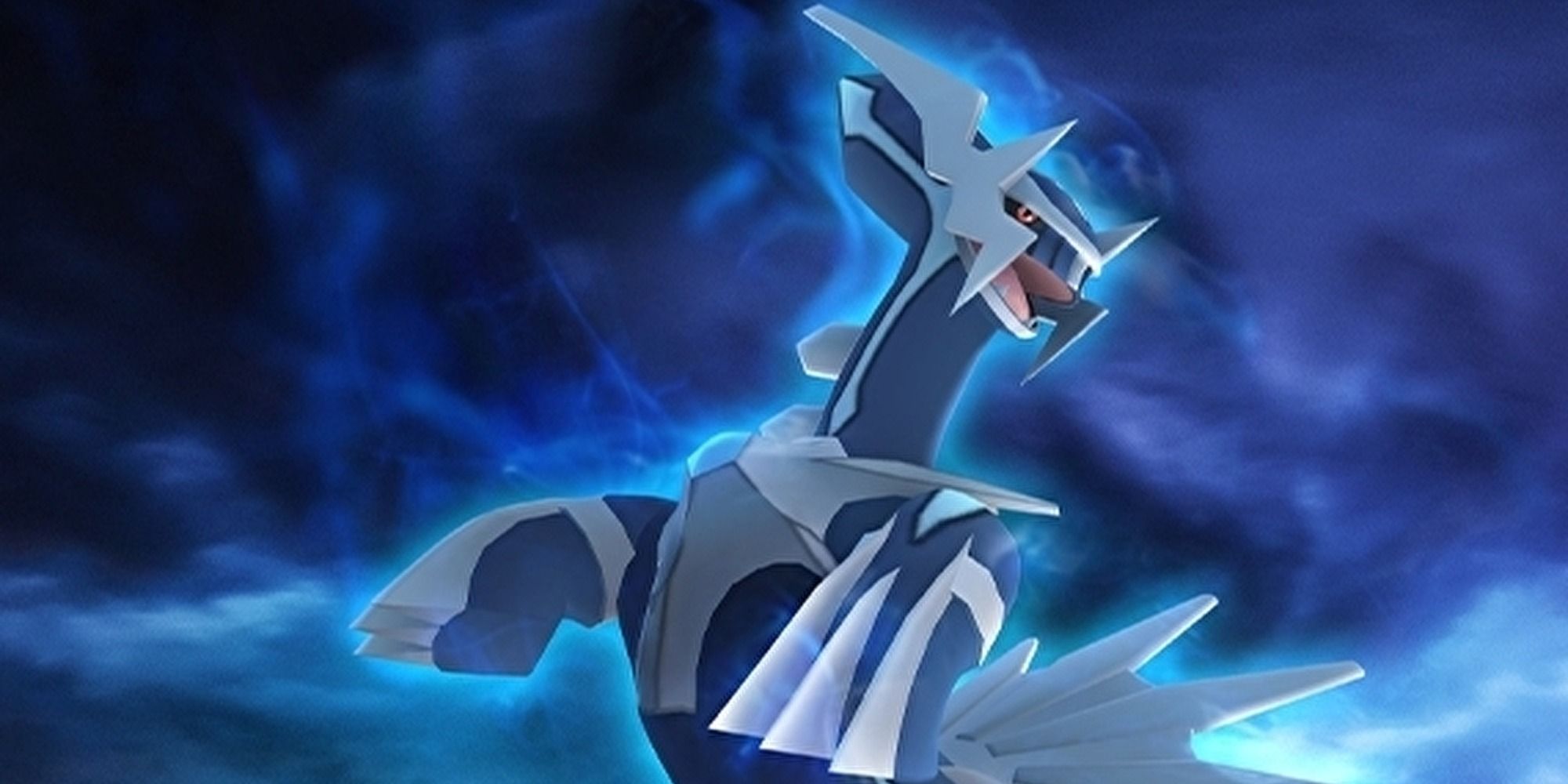 Dialga rearing up against a dark blue and black sky background.