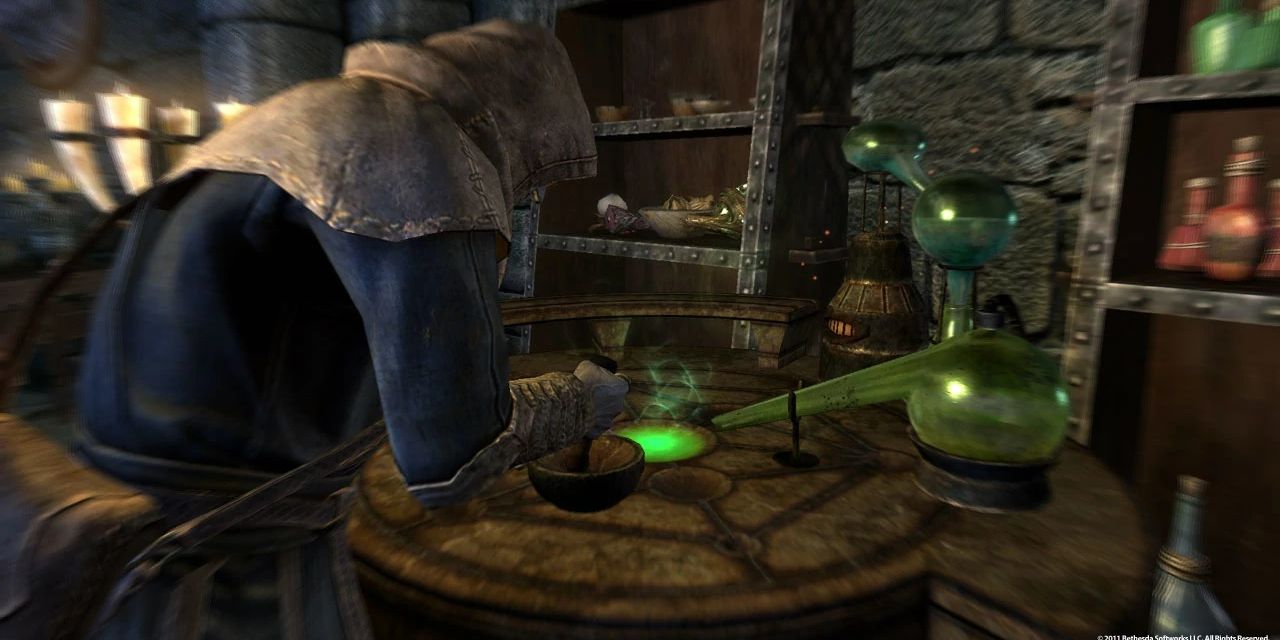 A player using an Alchemy lab in Skyrim