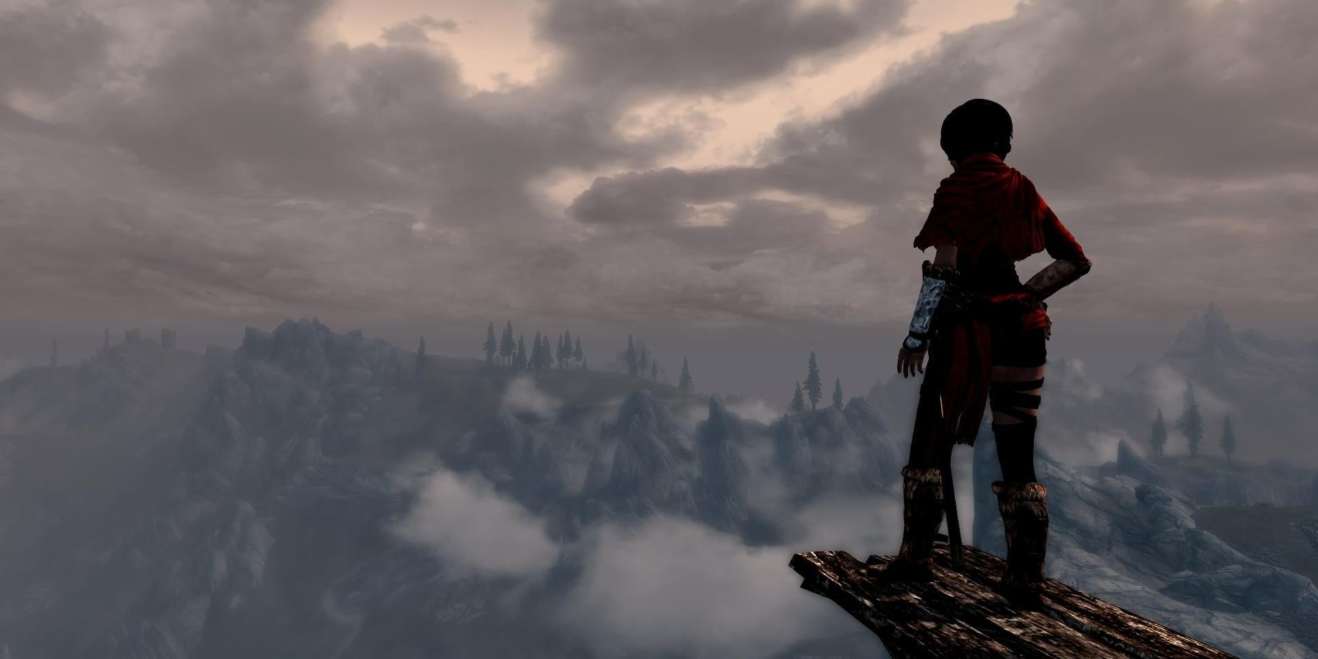 A player hanging off a cliff in Skyrim