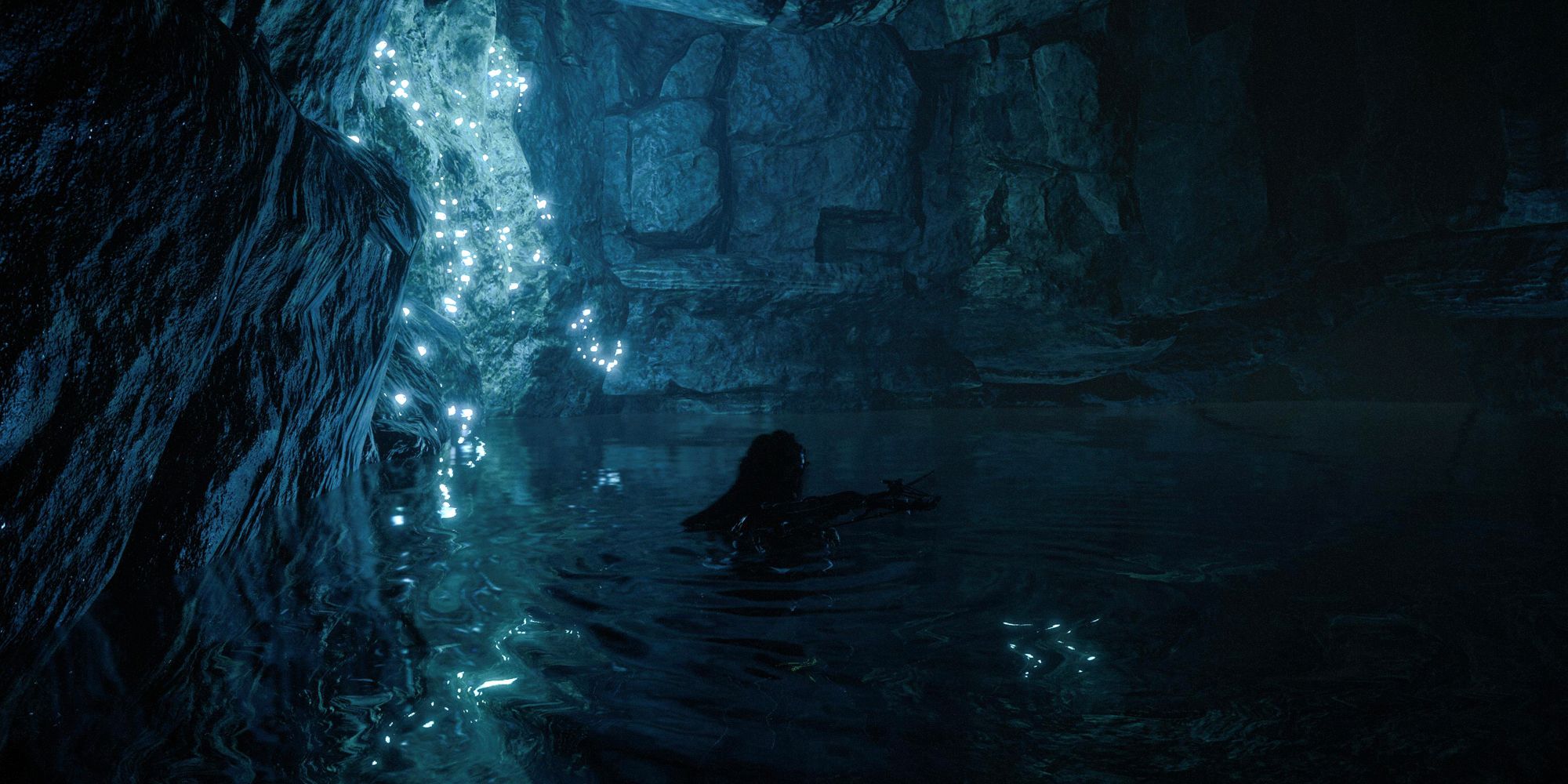 Horizon Forbidden West Aloy swimming in a cave. Dim blue lighting.