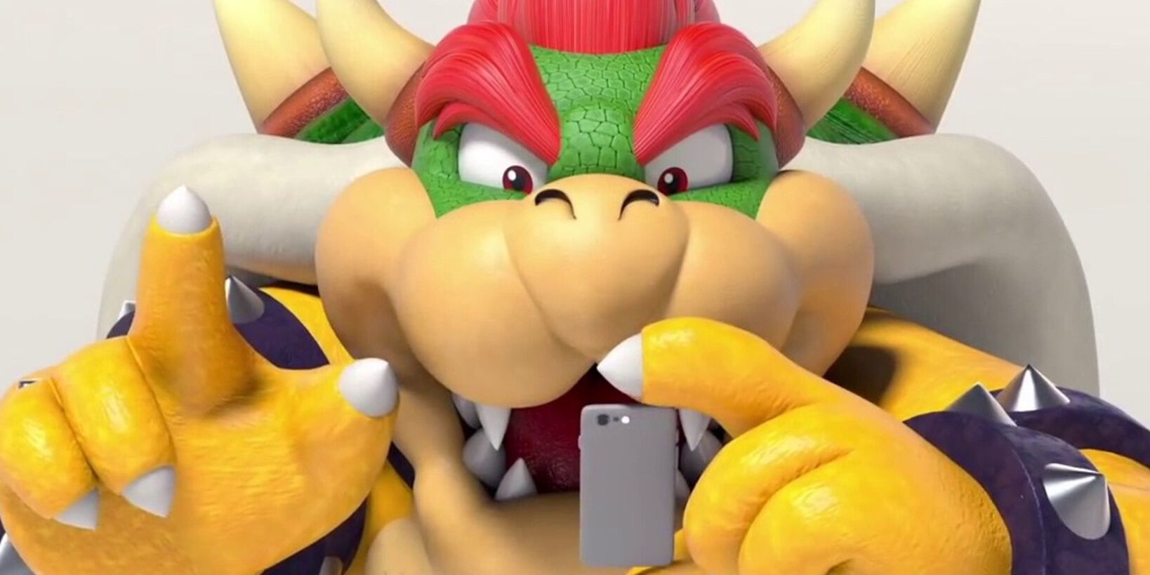 Bowser from Super Mario with a phone
