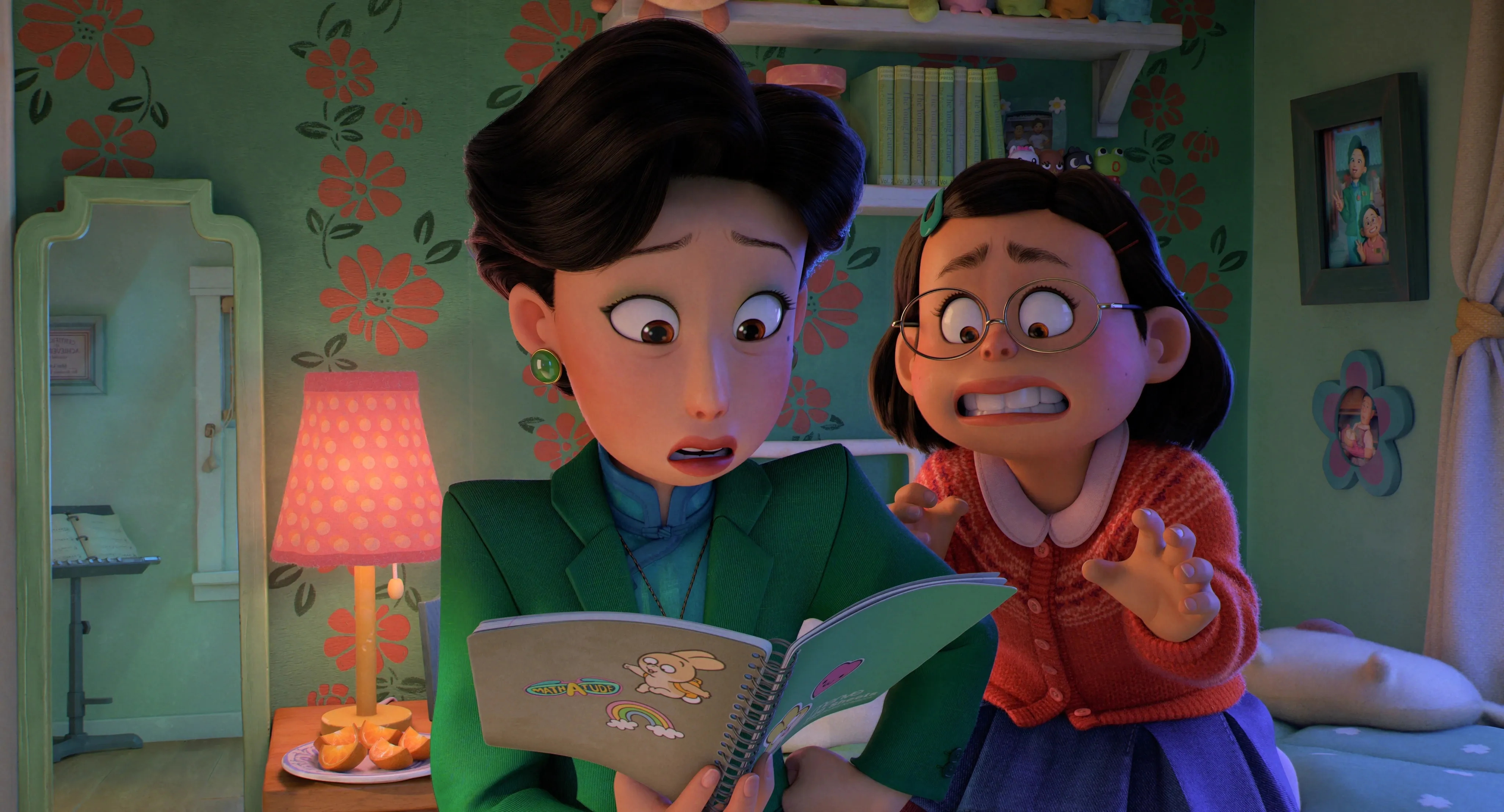 Mei and her mother reading her diary in Turning Red