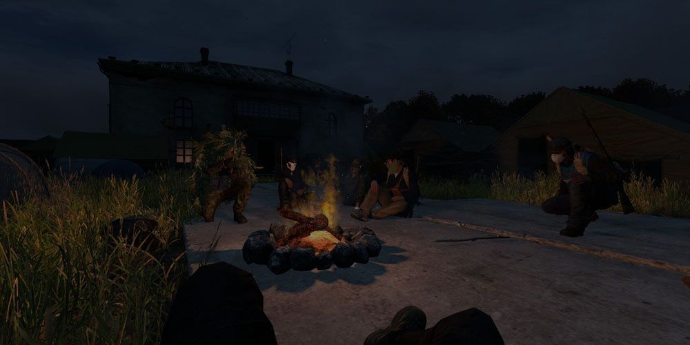 A group of survivors sharing a campfire in Dayz